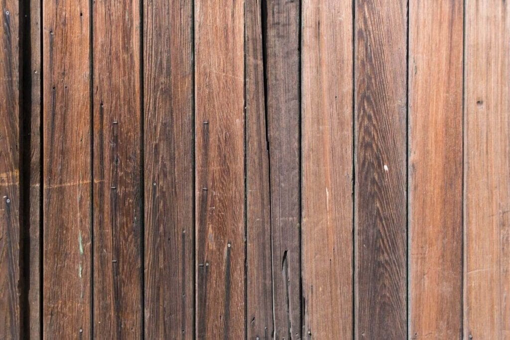 A dark hardwood floor with gaps in them
